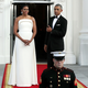 When bae looks like a bag of money: The president gives a thumbs-up while looking at his wife, the first lady, before an official state dinner at the White House on Aug. 2, 2016.
Chip Somodevilla/Getty Images